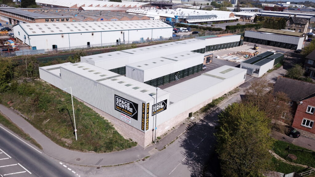 Aerial view of a managed self storage site with reception and container-based storage units in England.